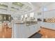 Open-concept kitchen with granite counters, center island, and a seamless flow into the living area at 17301 Ladera Estates Blvd, Lutz, FL 33548