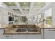 Gourmet kitchen with granite countertops and an island sink overlooking the open-concept living space at 17301 Ladera Estates Blvd, Lutz, FL 33548