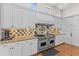 This kitchen features professional-grade stainless steel appliances, granite countertops and custom cabinetry at 17301 Ladera Estates Blvd, Lutz, FL 33548