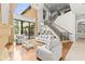 Spacious living room featuring high ceilings, large windows, and elegant decor at 17301 Ladera Estates Blvd, Lutz, FL 33548