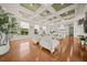 Open-concept living area with hardwood floors and a view to the kitchen at 17301 Ladera Estates Blvd, Lutz, FL 33548
