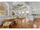 Open-concept kitchen and living area with coffered ceilings and hardwood floors at 17301 Ladera Estates Blvd, Lutz, FL 33548