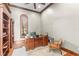 Traditional home office with a wood desk, a leather chair, and custom wood shelving at 17301 Ladera Estates Blvd, Lutz, FL 33548