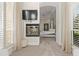 Sitting room boasts a cozy fireplace and is conveniently situated off of the main bedroom at 17301 Ladera Estates Blvd, Lutz, FL 33548