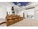 Spacious theater room with tiered seating, custom ceiling, and easy access to other rooms at 17301 Ladera Estates Blvd, Lutz, FL 33548