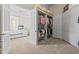 Walk-in closet offers custom storage with shelving, cabinets, and abundant natural light at 17301 Ladera Estates Blvd, Lutz, FL 33548