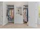 Walk-in closet featuring custom storage with cabinets, shelving, and dressing table at 17301 Ladera Estates Blvd, Lutz, FL 33548