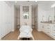 Bathroom features stand-alone tub, double walk-in shower, and double sink vanity at 180 Rotonda N Blvd, Rotonda West, FL 33947