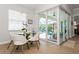 Dining area with sliding glass doors to the outdoor patio and pool at 180 Rotonda N Blvd, Rotonda West, FL 33947