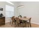 Dining area with a modern light fixture, wine storage, and sleek design at 180 Rotonda N Blvd, Rotonda West, FL 33947