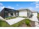 Beautiful home exterior showcasing the screened-in pool, patio, landscaping, and well-maintained surroundings at 180 Rotonda N Blvd, Rotonda West, FL 33947