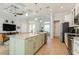 Open concept kitchen with large island, pendant lighting, and modern appliances at 180 Rotonda N Blvd, Rotonda West, FL 33947