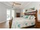 Bright main bedroom boasts tray ceilings, wood furniture, and access to outdoor pool area at 180 Rotonda N Blvd, Rotonda West, FL 33947
