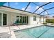 Sparkling pool with screened enclosure offers serene relaxation and outdoor enjoyment at 180 Rotonda N Blvd, Rotonda West, FL 33947