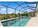 Sparkling pool with screened enclosure offers serene relaxation and outdoor enjoyment at 180 Rotonda N Blvd, Rotonda West, FL 33947