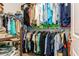 Walk-in closet featuring custom shelving and ample storage space for clothing and accessories at 180 Rotonda N Blvd, Rotonda West, FL 33947