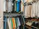 Walk-in closet featuring custom shelving and ample storage space for clothing and shoes at 180 Rotonda N Blvd, Rotonda West, FL 33947