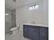 Modern bathroom featuring gray tiled shower, stylish vanity and light fixtures at 1801 N Morgan St # 5, Tampa, FL 33602