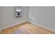 Well lit bedroom features wood floors and a window at 1801 N Morgan St # 5, Tampa, FL 33602