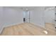 Spacious bedroom with hardwood floors and white walls, leading to additional rooms at 1801 N Morgan St # 5, Tampa, FL 33602
