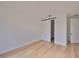 Clean bedroom featuring hardwood floors and a modern barn door at 1801 N Morgan St # 5, Tampa, FL 33602