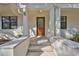 Inviting front entryway with a modern wood door, concrete steps, and white siding at 1801 N Morgan St # 5, Tampa, FL 33602