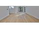 Bright living room with hardwood floors, white walls, and large windows at 1801 N Morgan St # 5, Tampa, FL 33602