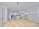 Bright living room with hardwood floors and open access to kitchen with stainless steel appliances at 1801 N Morgan St # 5, Tampa, FL 33602