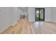 Spacious living room features wood floors and glass patio doors at 1801 N Morgan St # 5, Tampa, FL 33602