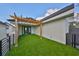 Outdoor patio features artificial grass and a pergola at 1801 N Morgan St # 5, Tampa, FL 33602