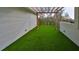 Outdoor patio with artificial grass and pergola at 1801 N Morgan St # 5, Tampa, FL 33602