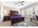 This bedroom features a wooden bed frame, neutral walls, and white shuttered windows, creating a warm and inviting space at 18258 Wayne Rd, Odessa, FL 33556
