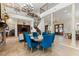 Elegant great room with a fireplace, soaring ceilings, and a large dining table at 18258 Wayne Rd, Odessa, FL 33556