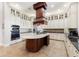 Gourmet kitchen with custom cabinets, a marble island, and stainless steel appliances at 18258 Wayne Rd, Odessa, FL 33556