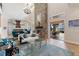 Bright living room featuring a stone fireplace, and access to an outdoor seating area at 18258 Wayne Rd, Odessa, FL 33556