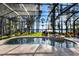Stunning screened-in pool and spa area with views of the lake at 18258 Wayne Rd, Odessa, FL 33556