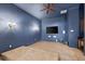 Cozy theater room with tiered seating, a large screen, and ambient lighting at 18258 Wayne Rd, Odessa, FL 33556