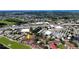 Wide aerial shot showcasing community, nearby shopping, highway access and distant ocean view at 2593 Countryside Blvd # 7305, Clearwater, FL 33761