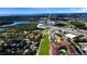 A lovely aerial view showing a serene complex near a lake and close to urban services and amenities at 2593 Countryside Blvd # 7305, Clearwater, FL 33761
