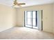 Bright bedroom with sliding doors to patio at 2593 Countryside Blvd # 7305, Clearwater, FL 33761