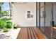 Lobby entrance showcasing tile flooring, stucco walls, and a glass door at 2593 Countryside Blvd # 7305, Clearwater, FL 33761