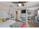 Bedroom featuring a four poster bed, a mounted television, and sliding closet doors at 2704 Dorene Dr, Plant City, FL 33563
