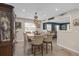 A charming dining area with a decorative chandelier and seating for six, perfect for Gathering meals and entertaining at 2704 Dorene Dr, Plant City, FL 33563