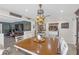 The dining room boasts stylish lighting and an open layout, seamlessly connecting to the kitchen and living areas at 2704 Dorene Dr, Plant City, FL 33563