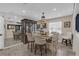 Elegant dining room featuring stylish chairs, a large hutch, and modern lighting at 2704 Dorene Dr, Plant City, FL 33563