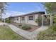 Single-story home with well-maintained landscaping and a sidewalk at 2704 Dorene Dr, Plant City, FL 33563