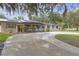 Charming single-story home with solar panels, mature landscaping, and a circular driveway at 2704 Dorene Dr, Plant City, FL 33563