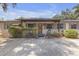 Charming single-story home with an inviting front porch and mature landscaping at 2704 Dorene Dr, Plant City, FL 33563