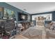 Inviting living room with a large tv, comfortable seating, and an open view to the dining area at 2704 Dorene Dr, Plant City, FL 33563