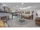 An inviting living room boasts a fireplace, with decor and plenty of natural light at 2704 Dorene Dr, Plant City, FL 33563